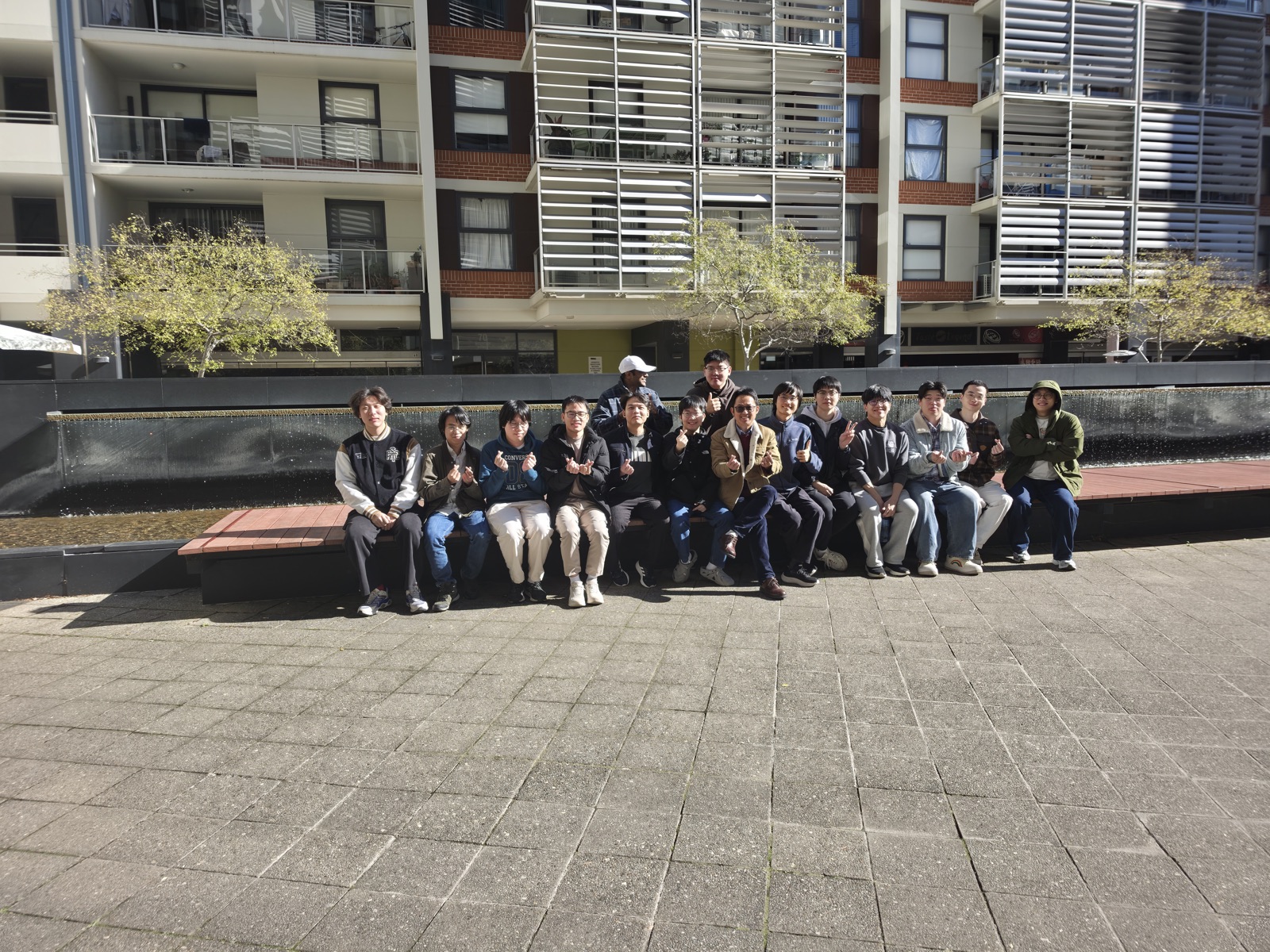 DUAL Group members gathered outdoors for a group lunch